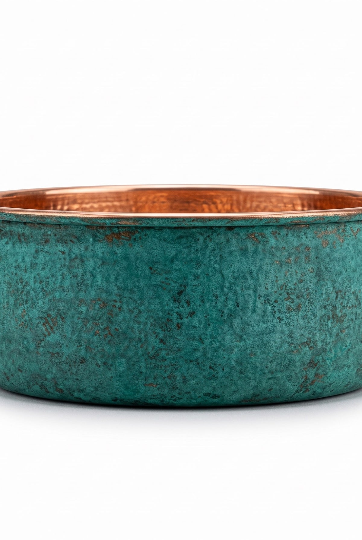 Side elevation of the copper pedicure bowl showing the straight sides and green patina