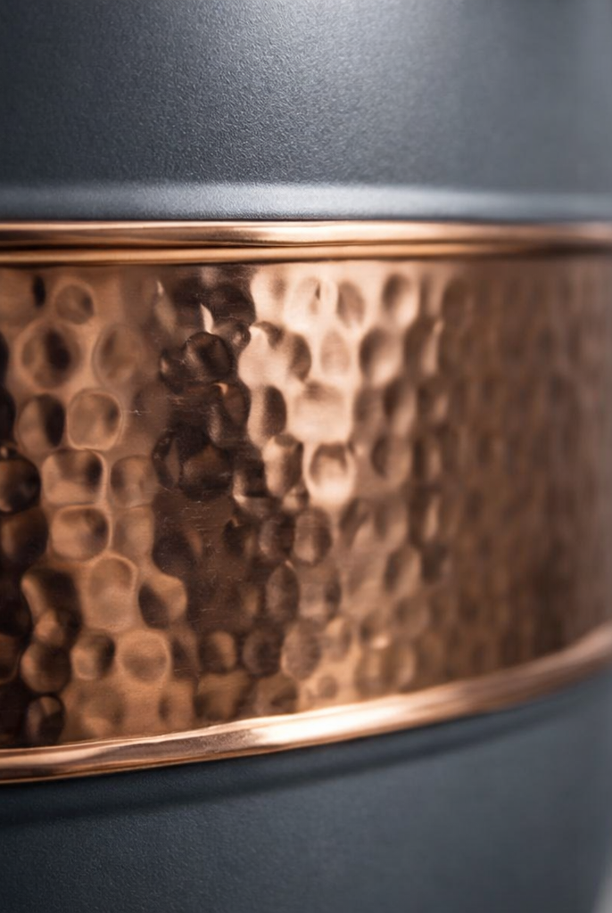 Elegant copper-banded water dispenser with a unique silk gray texture