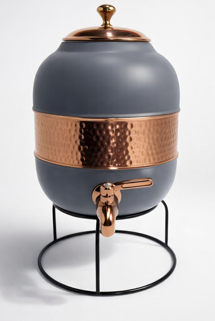 Close-up of a half-hammered copper dispenser showing the silk gray finish