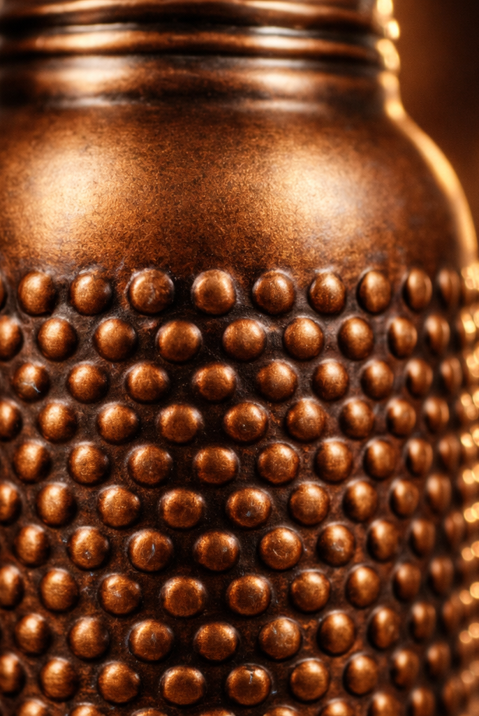 Handcrafted 950 ml pure copper bottle with a dark antique textured finish.