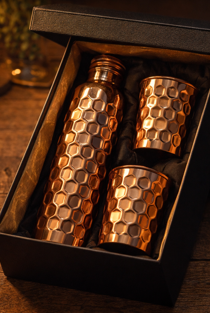 Shiny polish copper bottle and glass set featuring intricate embossed patterns.