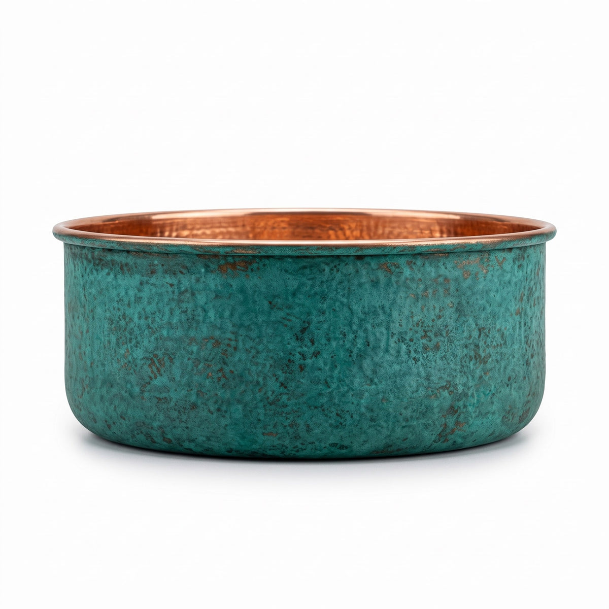 Side elevation of the copper pedicure bowl showing the straight sides and green patina