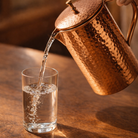 Hand hammered copper jug from the 1.5L set, showing the lid and curved handle