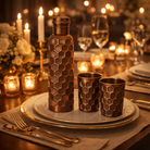 Pure copper embossed water bottle and two glasses with an antique finish
