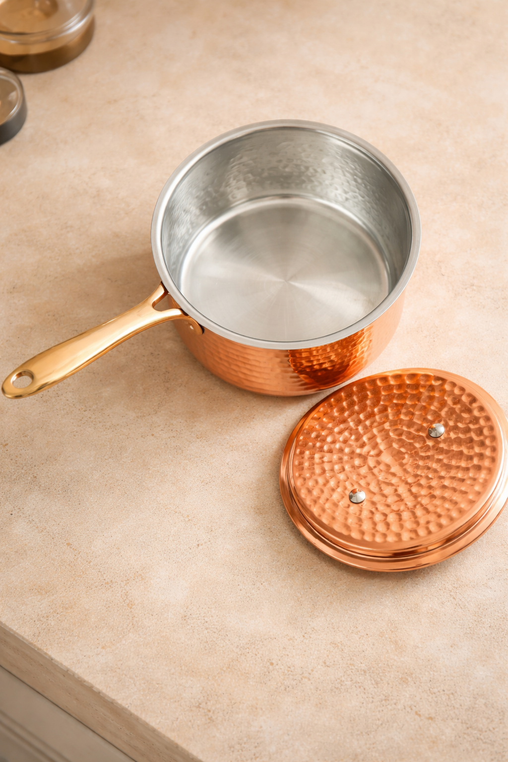 Copper saucepan interior showing tin lining for safe cooking