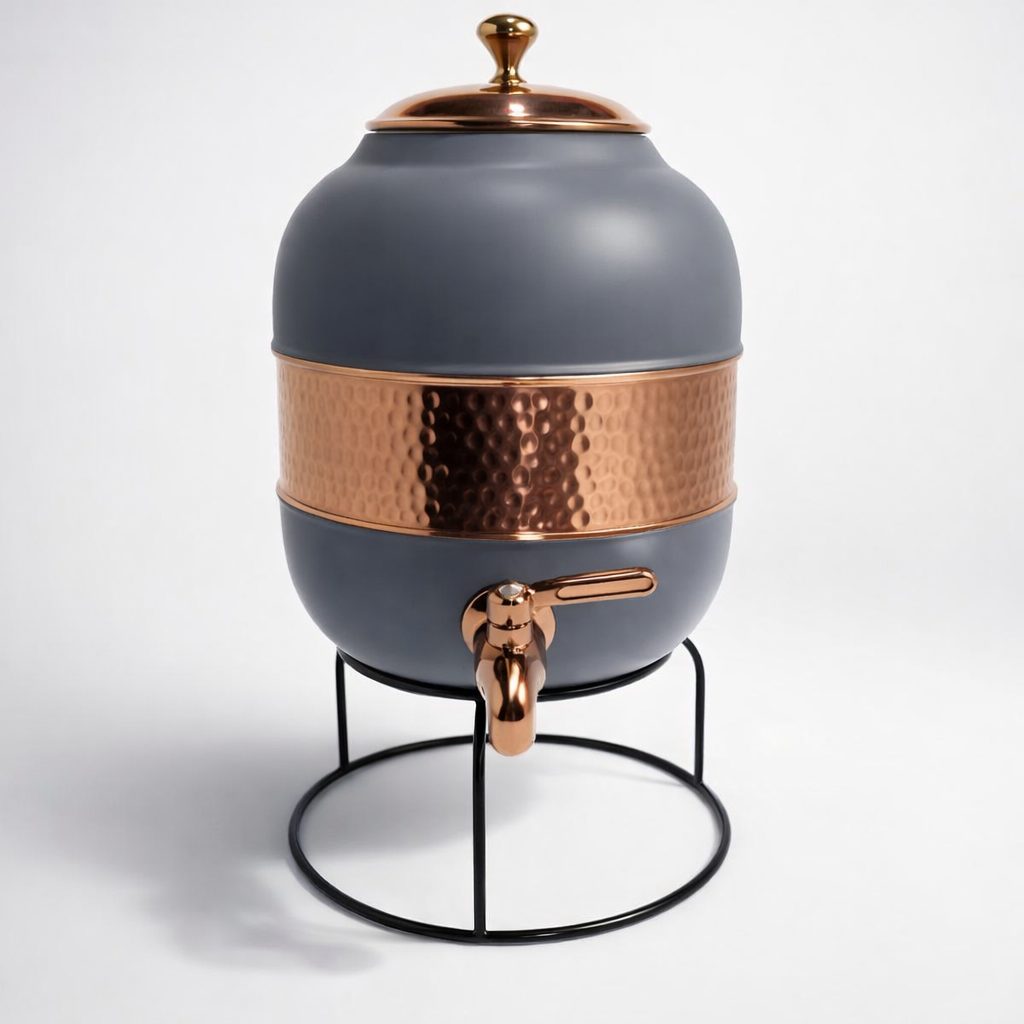 Close-up of a half-hammered copper dispenser showing the silk gray finish