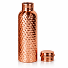 Elegant hand-hammered copper water bottle displayed for healthy hydration.