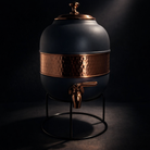 Stylish silk gray copper water dispenser with a metal tap.